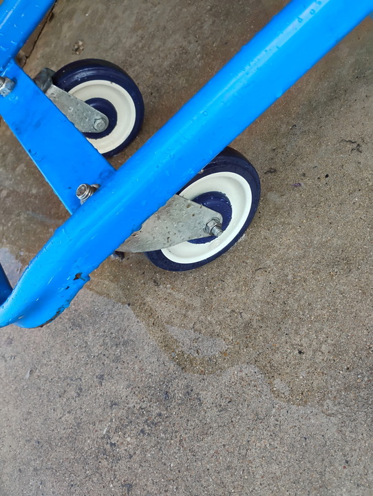 Two cart caster wheels scrubbed clean after servicing