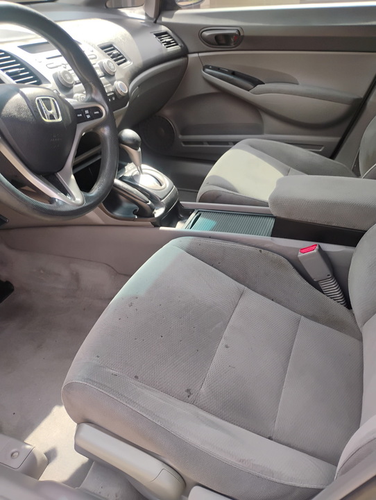 Front console and seats before an interior clean
