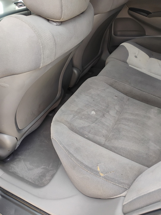 Rear seats dusty and stained before the interior detail