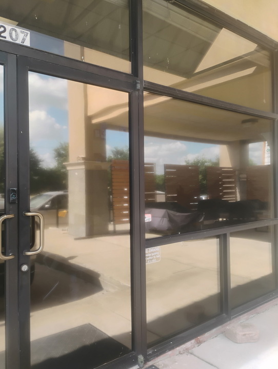 Tinted commercial glass door and window, finished