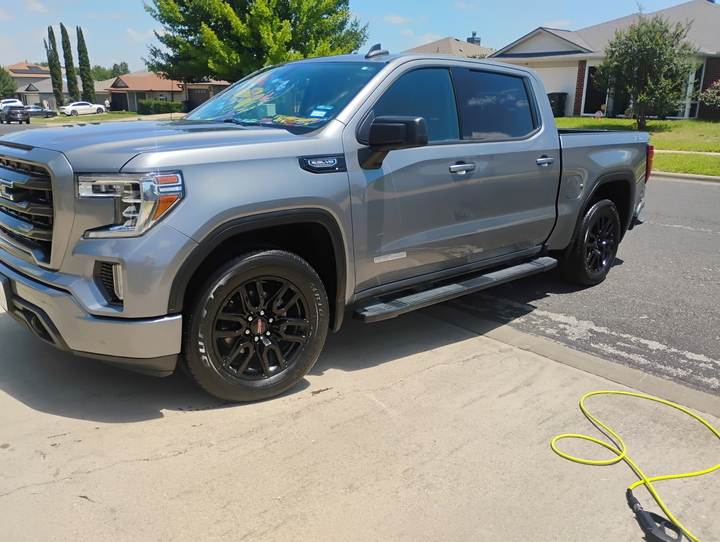Freshly detailed GMC Sierra pickup, exterior finished in a driveway