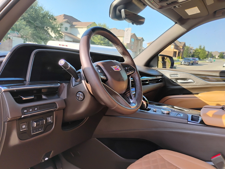 Detailed Cadillac Escalade interior with clean leather seats and dash